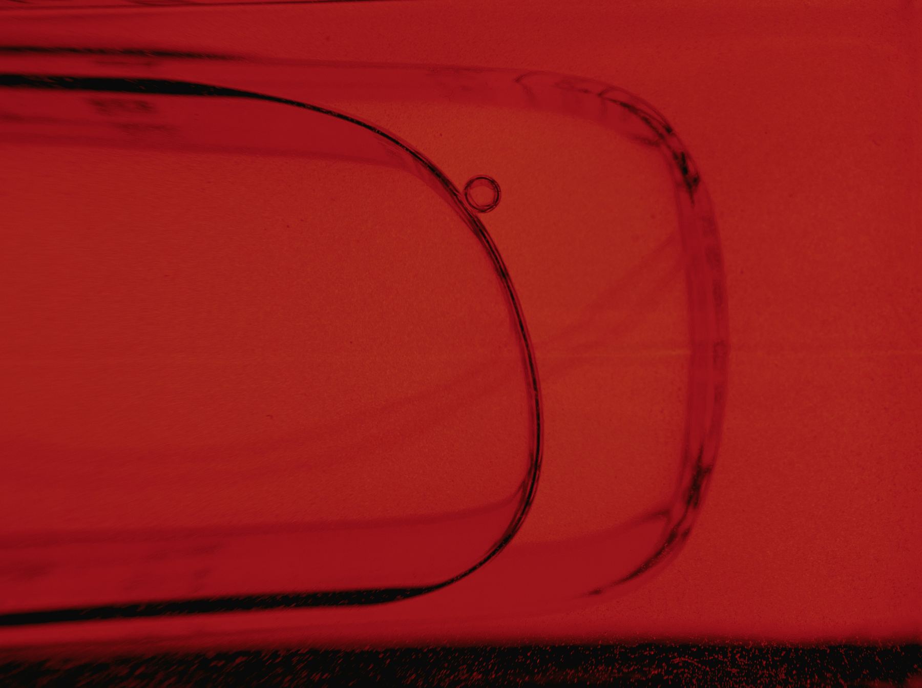 A red glass object, close up
